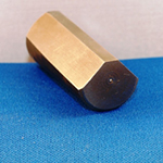 Tapered locking pin surface broached on three angular surfaces using a high speed broaching machine.