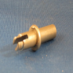 Automotive: Seat retainer pin. Slot is broached on a continuous chain broaching machine.