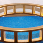Roller bearing cage. Squares broached on a horizontal machine two at a time.